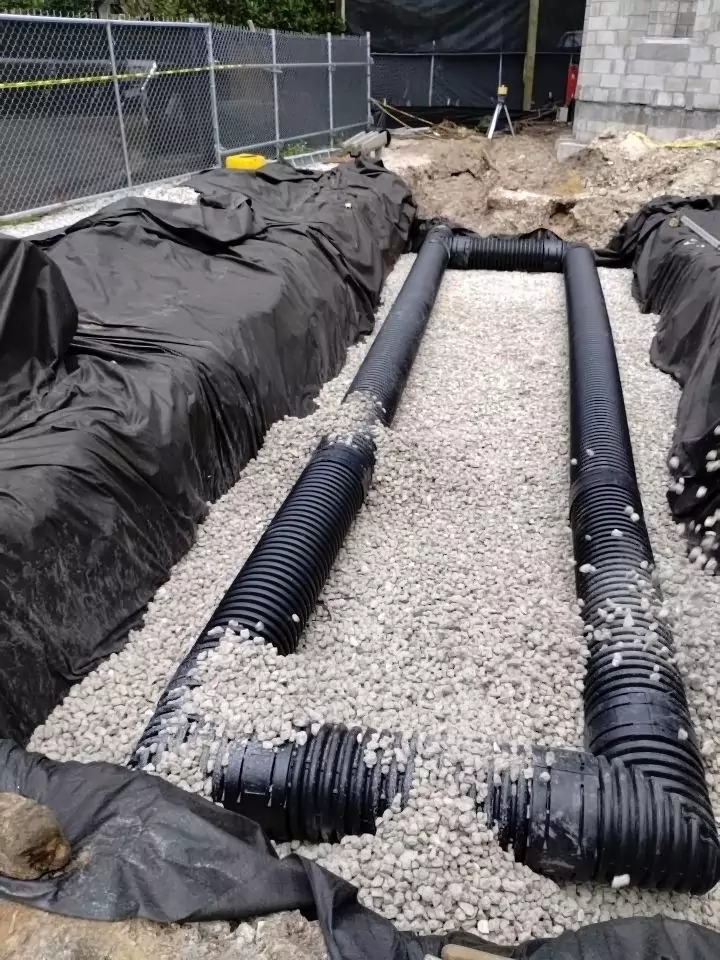 exfiltration trench with washed #4 rock and perforated pipe